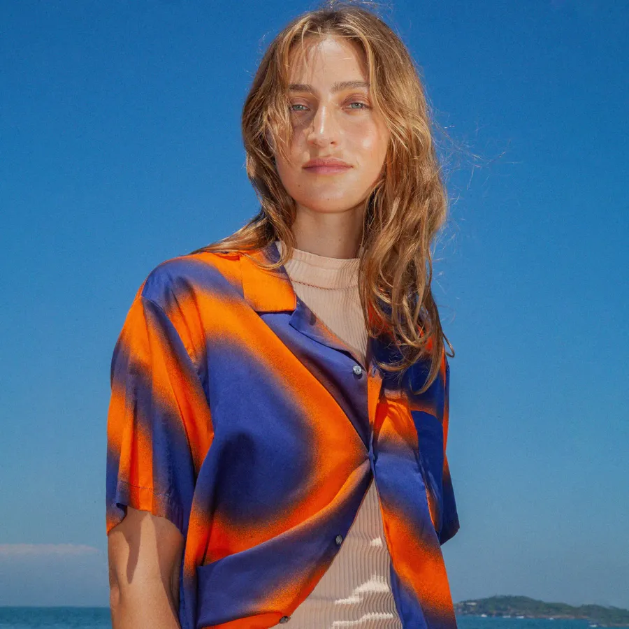 Double Rainbouu campaign shirt on Byron Bay beach